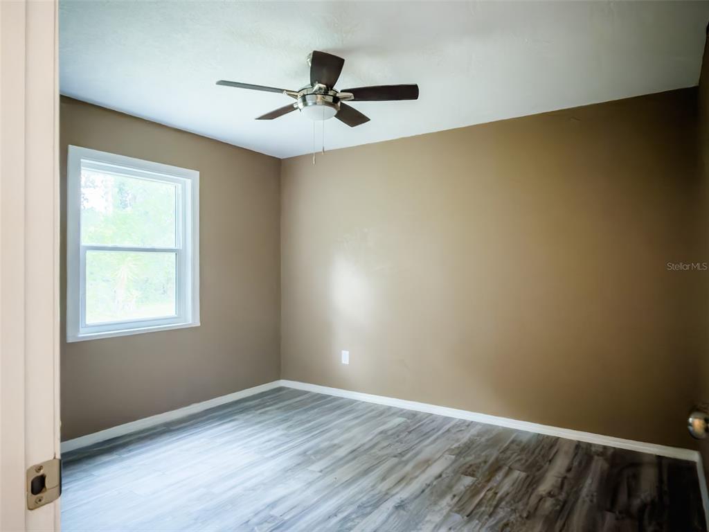 14522 Southeast 1st Av Road Summerfield, FL 34491 - Photo 15 of 30 an empty room with a window and a ceiling fan
