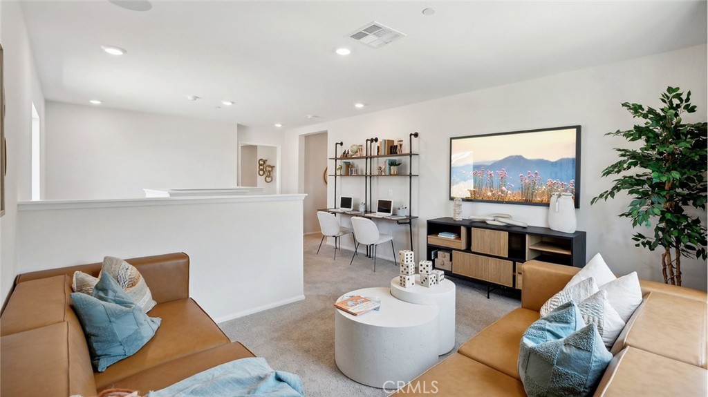 11392 Forge Road Corona, CA 92883 - Photo 13 of 24 a living room with furniture and a painting on the wall