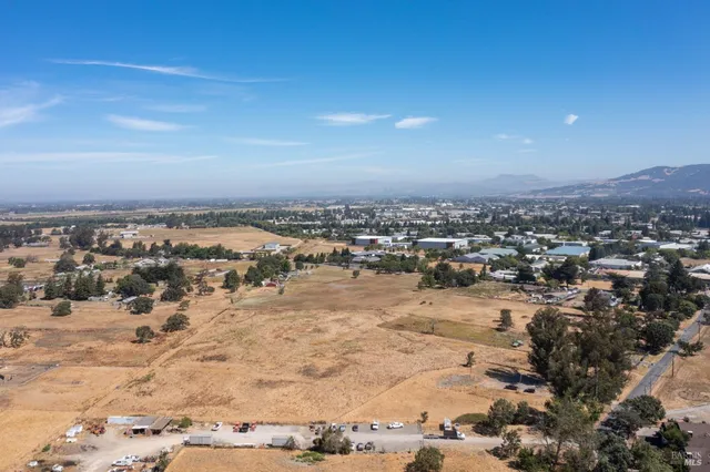 an aerial view of residential house and outdoor space
