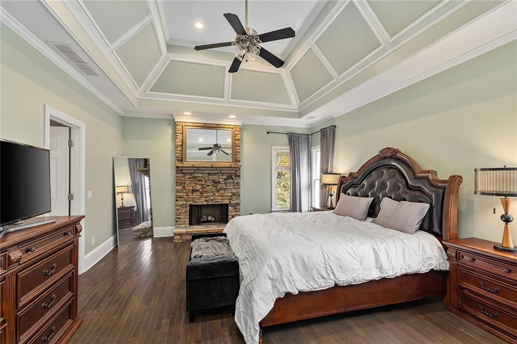 2694 Lenox Road Northeast Atlanta, GA 30324 - Photo 17 of 28 a bedroom with a bed and a flat screen tv