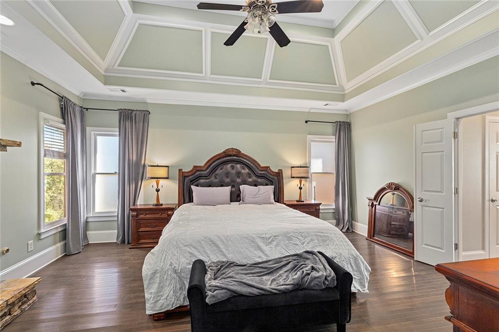 2694 Lenox Road Northeast Atlanta, GA 30324 - Photo 18 of 28 a bedroom with a bed and a painting on the wall