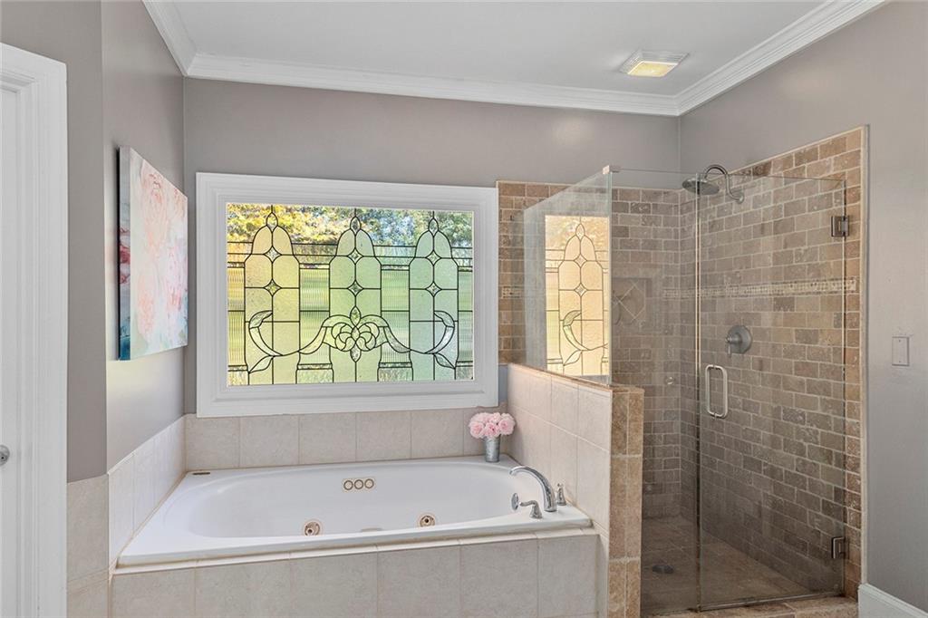 2694 Lenox Road Northeast Atlanta, GA 30324 - Photo 20 of 28 a white bath tub sitting next to a window