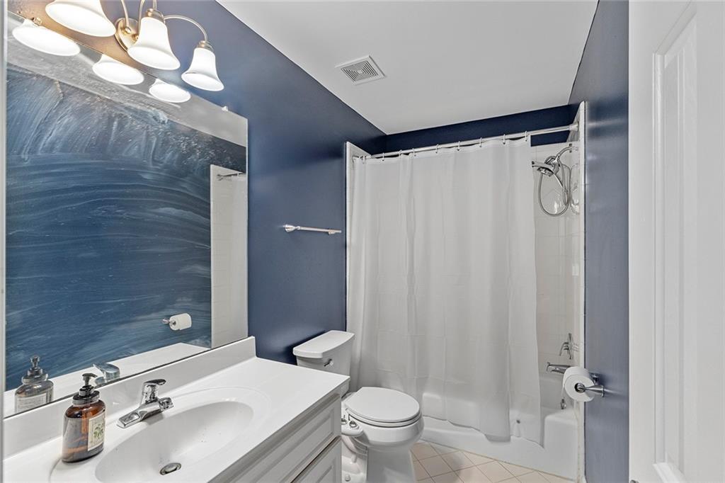 2694 Lenox Road Northeast Atlanta, GA 30324 - Photo 23 of 28 a bathroom with a sink toilet and shower