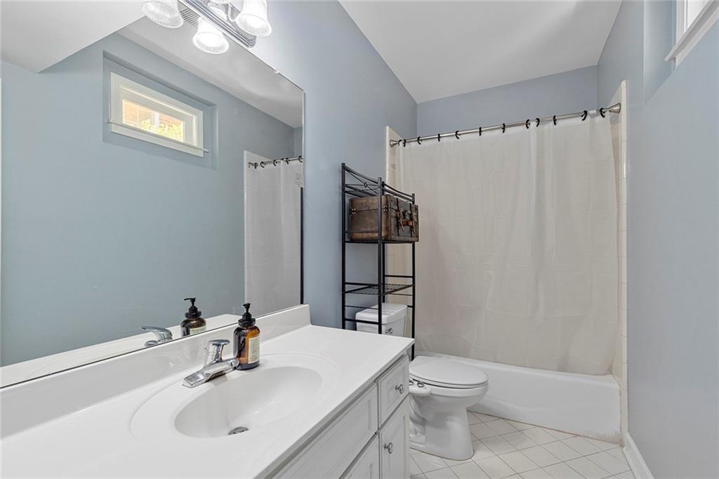 2694 Lenox Road Northeast Atlanta, GA 30324 - Photo 25 of 28 a bathroom with a sink toilet and shower
