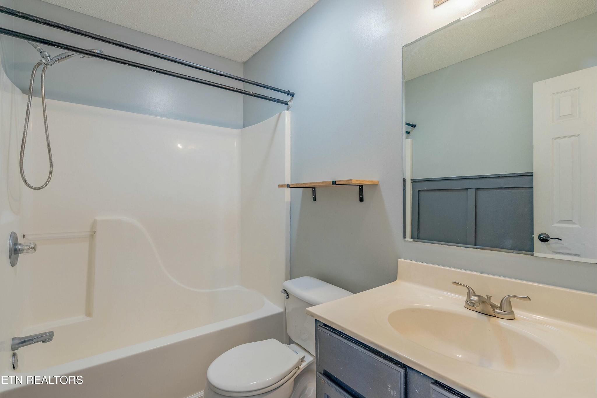 7724 Ralph Youmans Road Corryton, TN 37721 - Photo 17 of 19 a bathroom with a sink toilet and shower