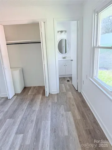 a white toilet sitting next to a white sink