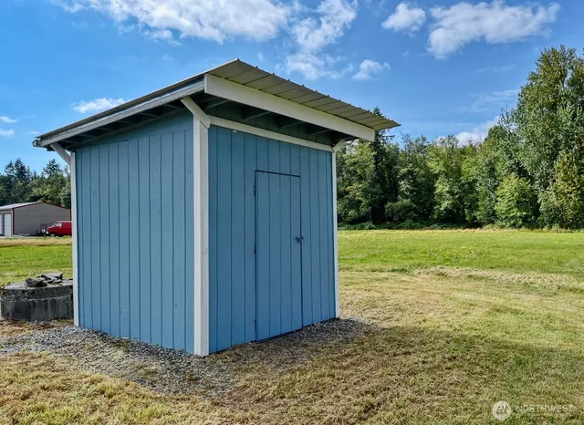 a wooden door in front of a house