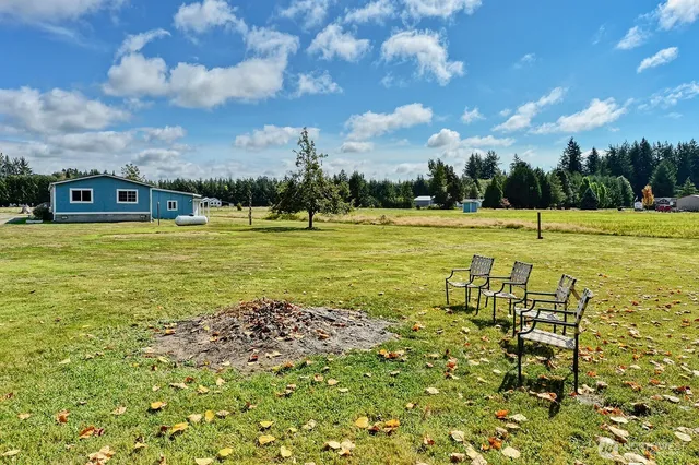 a view of a large swimming pool and an outdoor seating