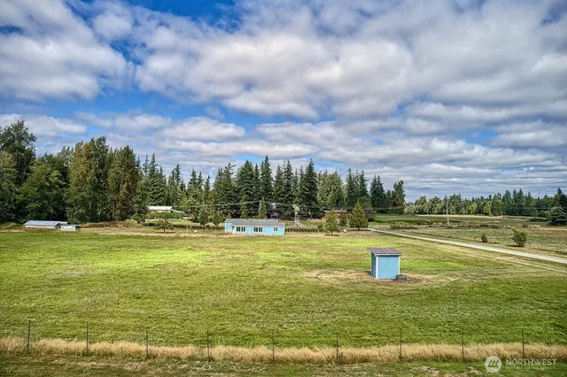 a view of a lake with a big yard