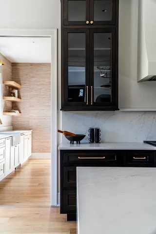 a kitchen with a cabinets and a wooden floor