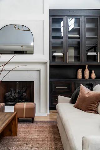 a bedroom with a bed and a fireplace