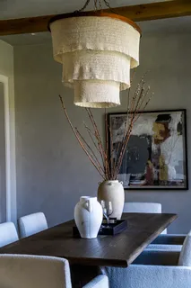 a living room with couches and a table with wooden floor