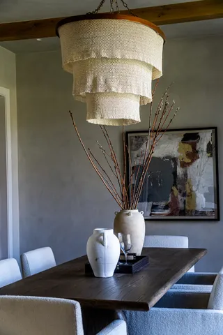 a living room with couches and a table with wooden floor