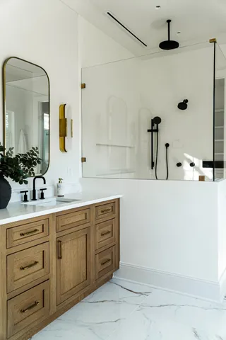 a bathroom with a double vanity sink and mirror