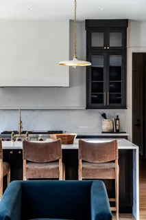 a kitchen with a sink a stove and a microwave