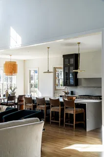 a group of chairs sitting in kitchen and dining room