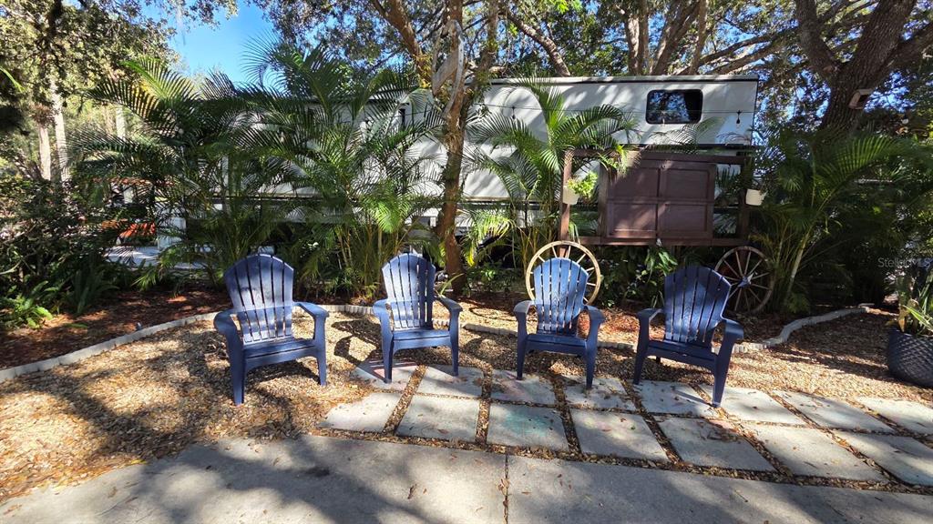 174 East Appaloosa Trail River Ranch, FL 33867 - Photo 4 of 20 a view of a chairs and tables in the patio