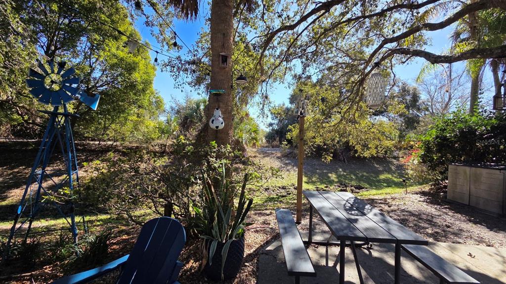 174 East Appaloosa Trail River Ranch, FL 33867 - Photo 8 of 20 a view of a chairs and table in the patio