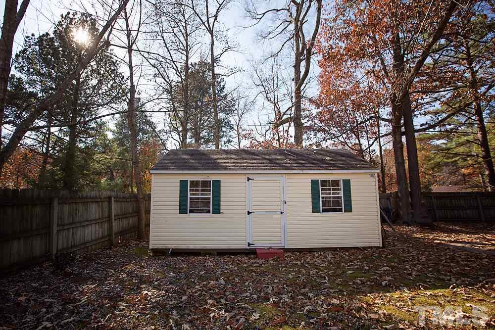 5602 McCormick Road Durham, NC 27713 - Photo 18 of 19 a view of a house with a yard