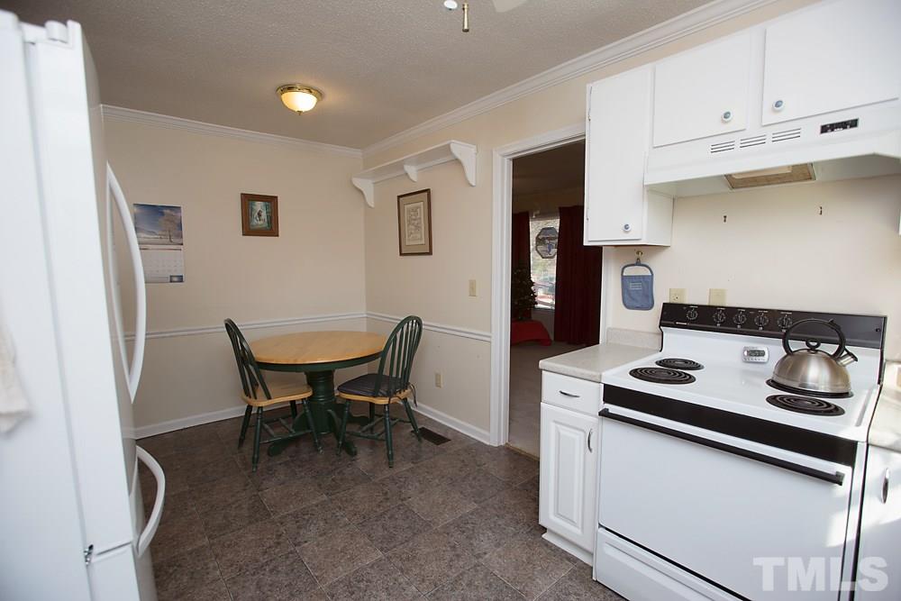5602 McCormick Road Durham, NC 27713 - Photo 5 of 19 a dining room with furniture and window