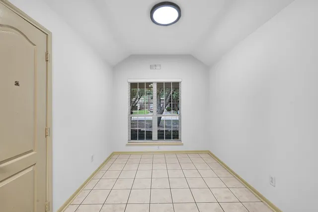 a large kitchen with granite countertop a stove sink and cabinets
