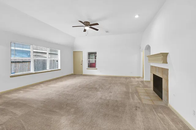 a view of an empty room with windows