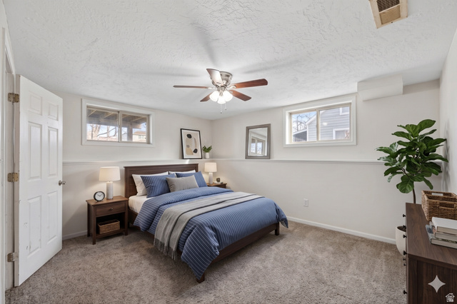 7879 Oak Street Midvale, UT 84047 - Photo 21 of 32 Carpeted room with white walls, a white paneled door, and two horizontal windows