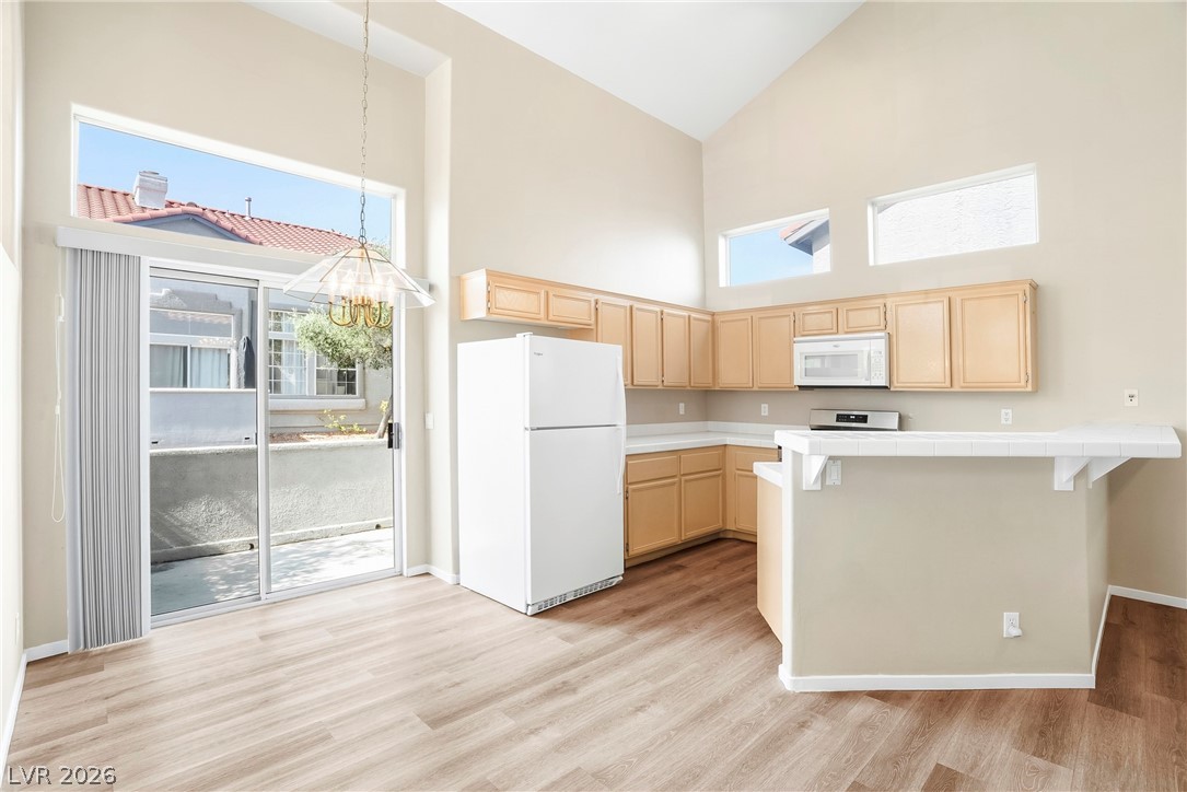 2232 Ramsgate Drive Henderson, NV 89074 - Photo 5 of 53 Sliders to the patio off the kitchen/dining.