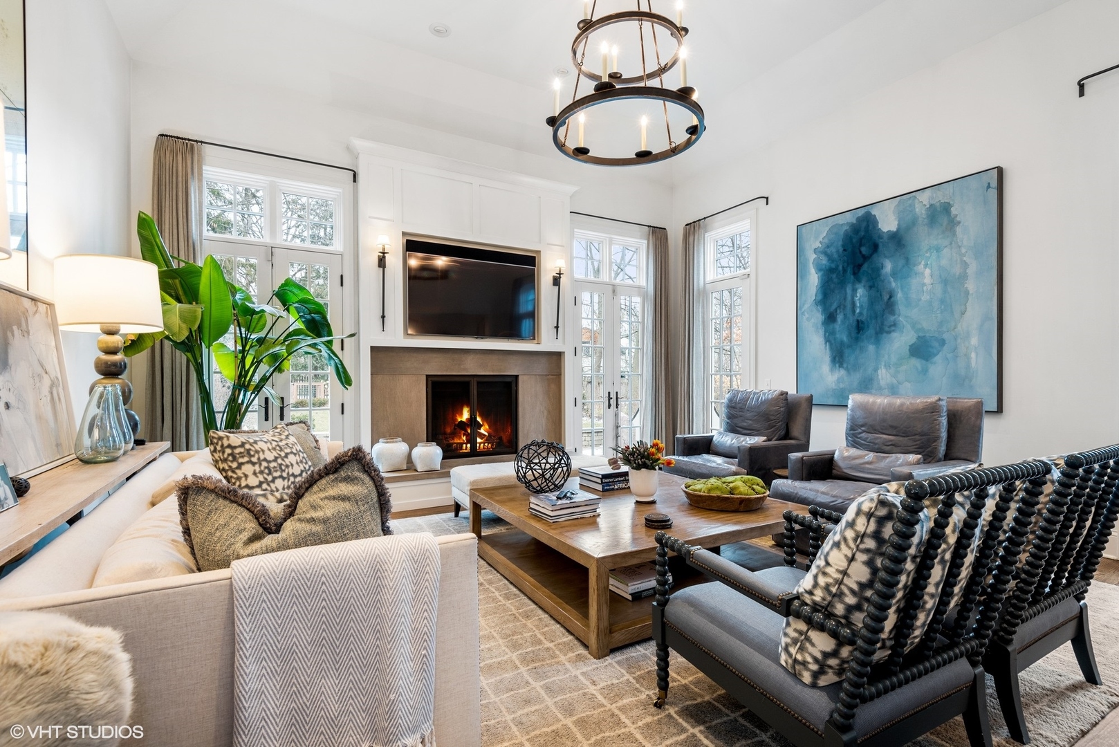 861 Bluff Street Glencoe, IL 60022 - Photo 14 of 51 a living room with furniture a fireplace and a flat screen tv