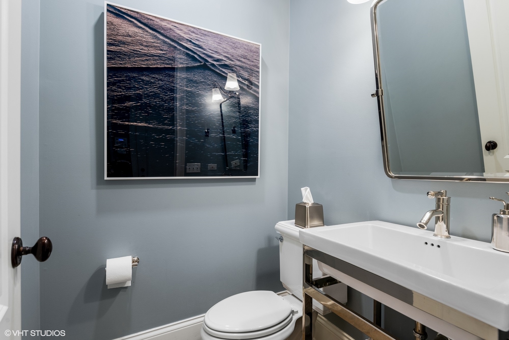 861 Bluff Street Glencoe, IL 60022 - Photo 21 of 51 a bathroom with a toilet sink and mirror