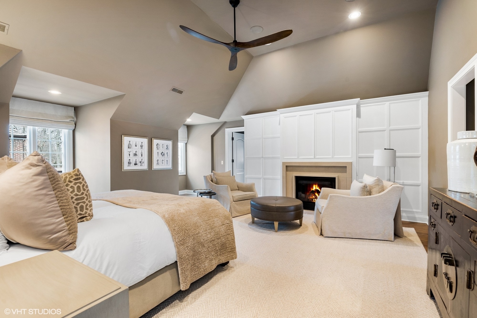 861 Bluff Street Glencoe, IL 60022 - Photo 22 of 51 a spacious bedroom with a balcony a bed and a fireplace