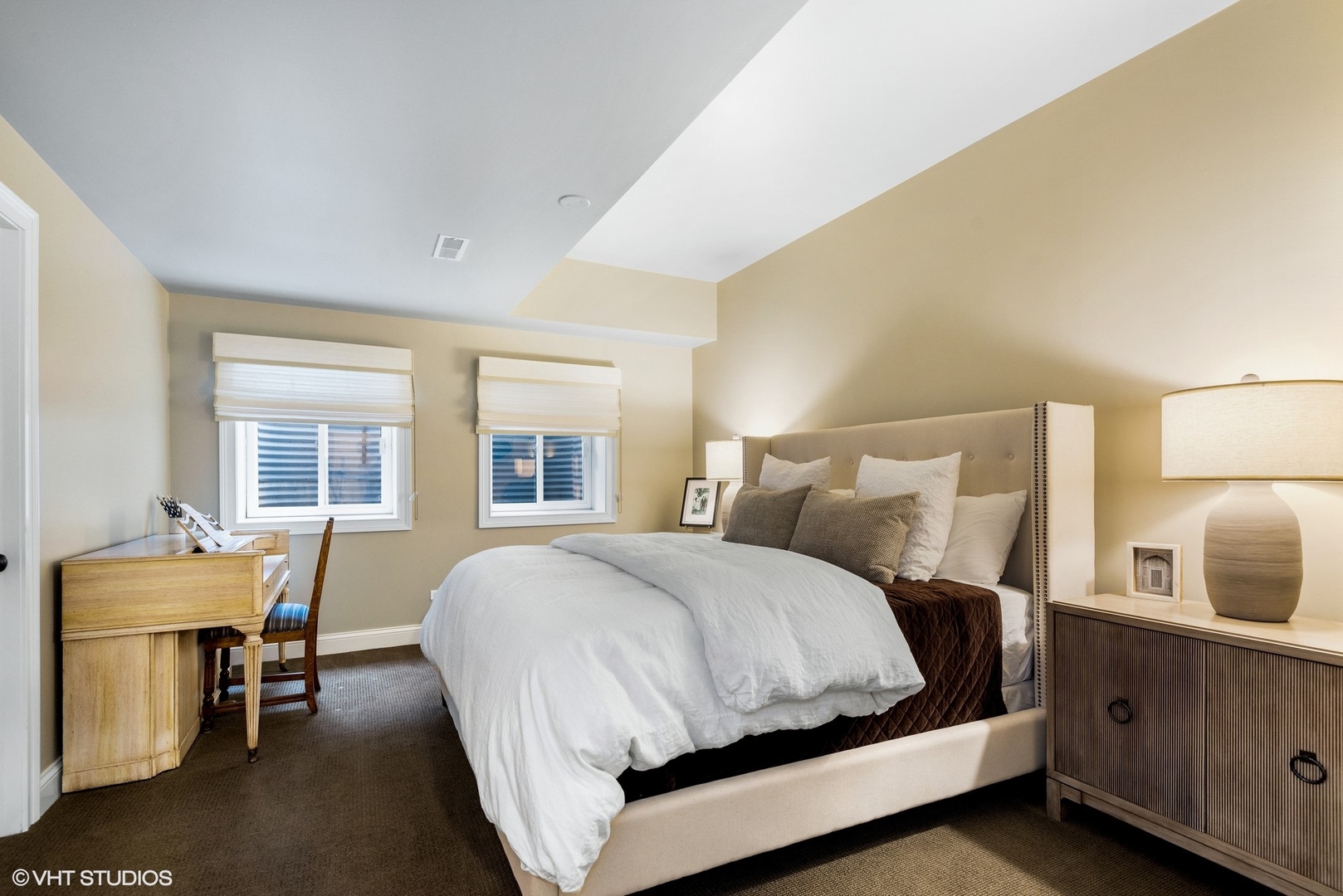 861 Bluff Street Glencoe, IL 60022 - Photo 37 of 51 a large bed sitting in a bedroom next to a window with lamp