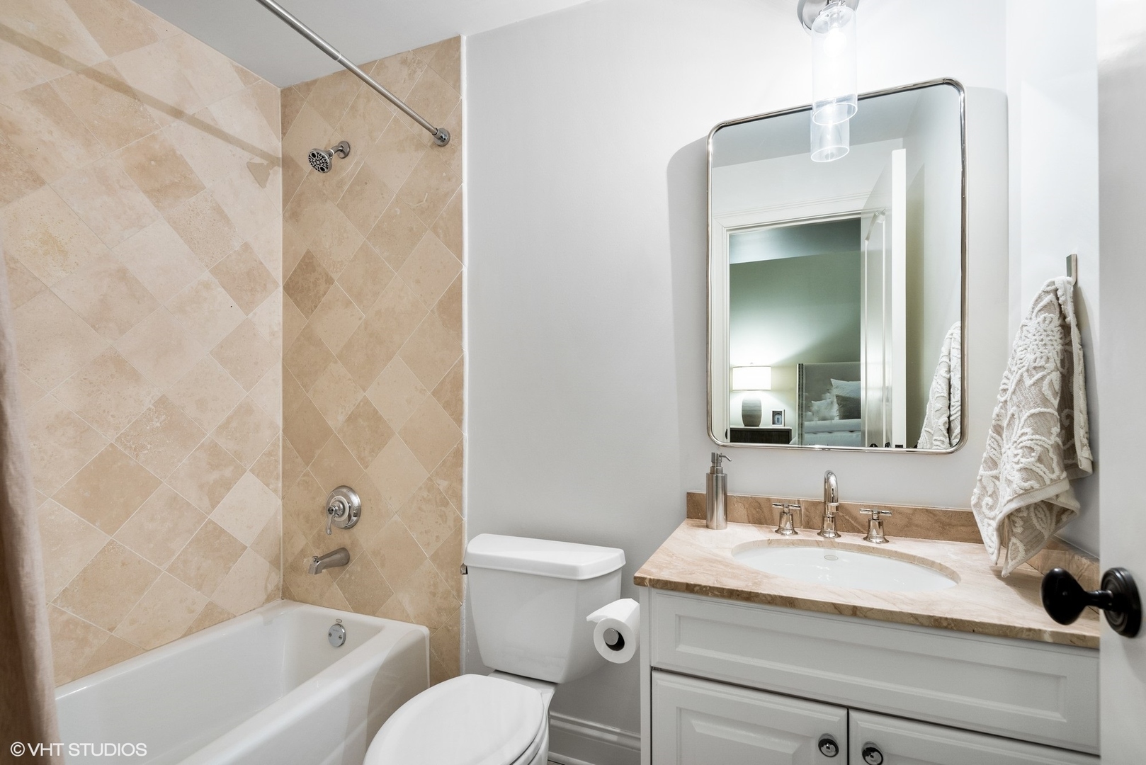 861 Bluff Street Glencoe, IL 60022 - Photo 38 of 51 a bathroom with a granite countertop sink toilet and shower