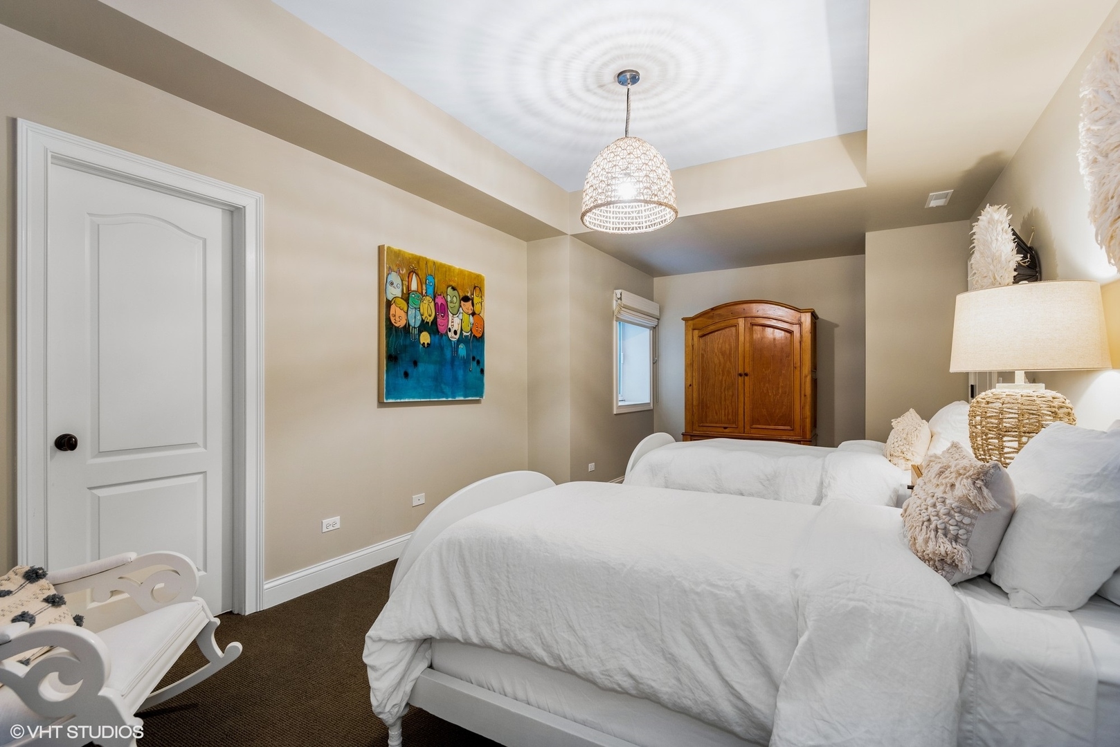 861 Bluff Street Glencoe, IL 60022 - Photo 39 of 51 a bedroom with a large bed and a chandelier