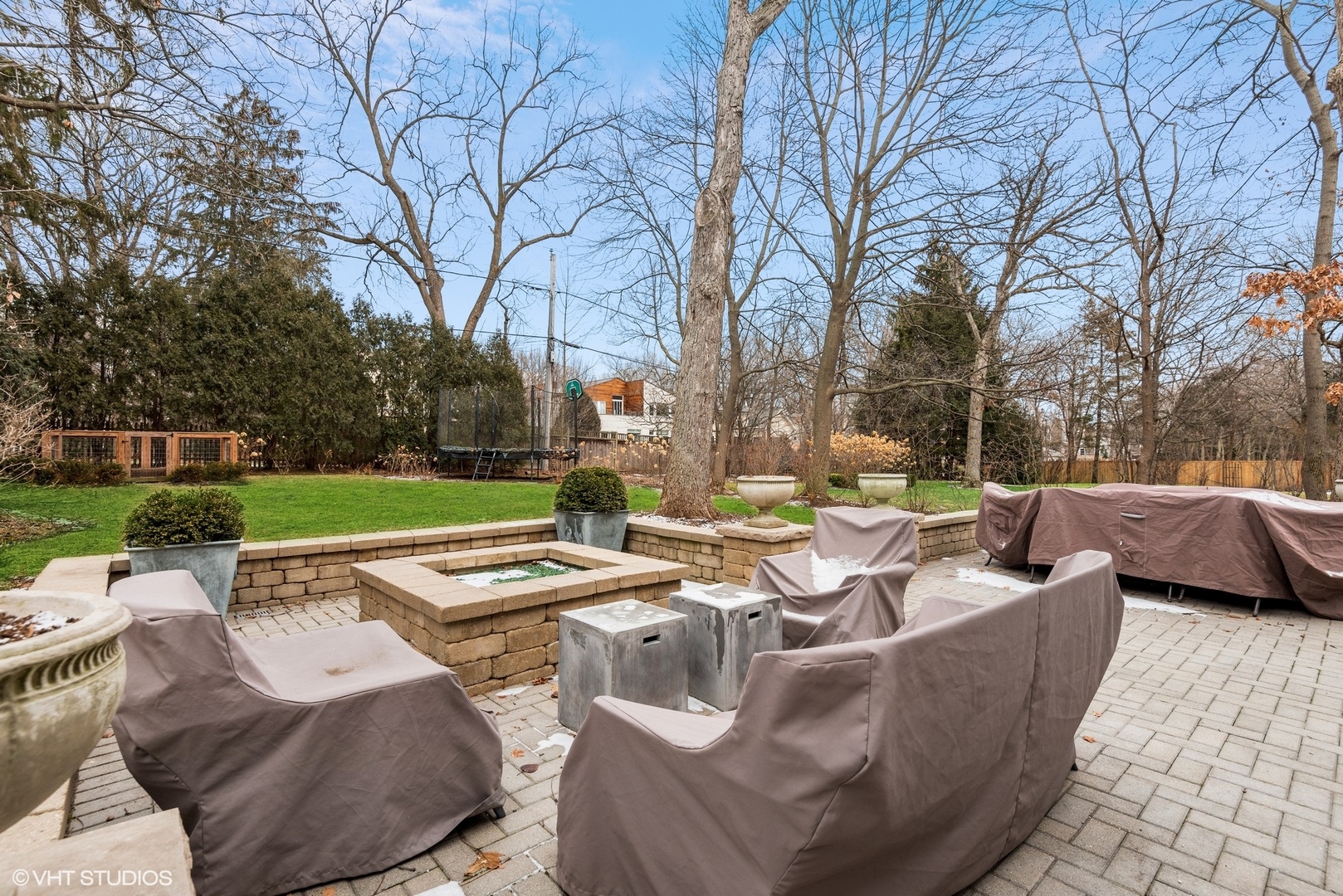 861 Bluff Street Glencoe, IL 60022 - Photo 45 of 51 a view of a patio with couches chairs and a fire pit