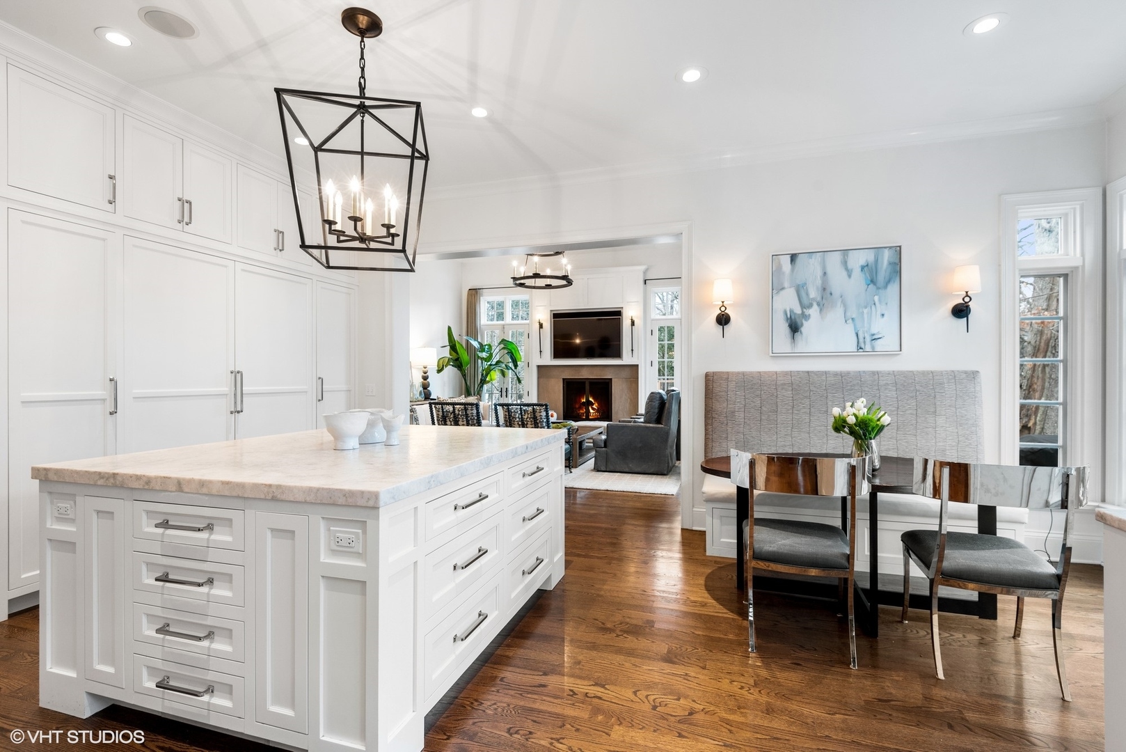 861 Bluff Street Glencoe, IL 60022 - Photo 9 of 51 a large white kitchen with furniture and a wooden floor