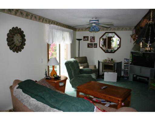 41 Old County Road Westfield, MA 01085 - Photo 5 of 28 a living room with furniture and a flat screen tv
