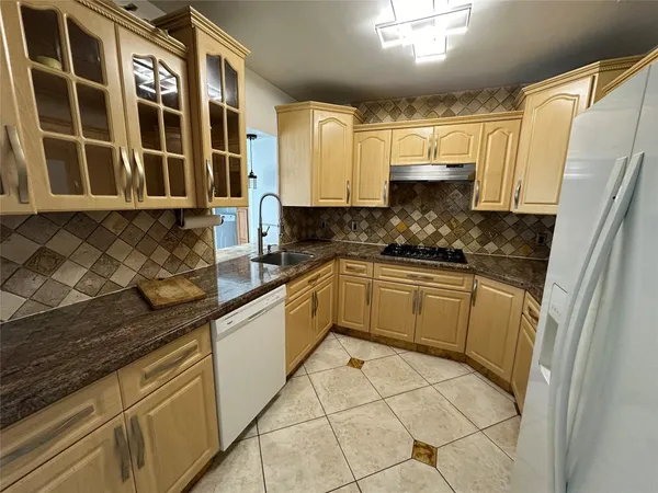 a kitchen with a sink and cabinets