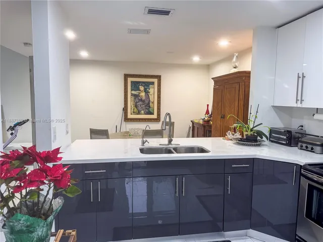 a bathroom with a sink vanity granite and a mirror
