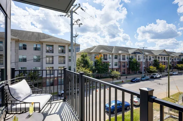 an aerial view of residential houses with city view