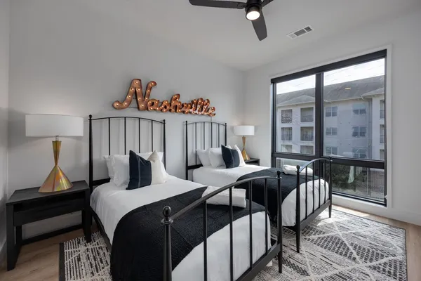 a bedroom with furniture and a window