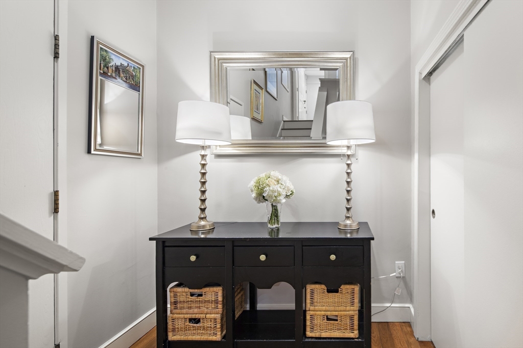 9 Appleton Street, Unit 304 Boston, MA 02116 - Photo 12 of 18 a view of hallway with mirror and cabinet