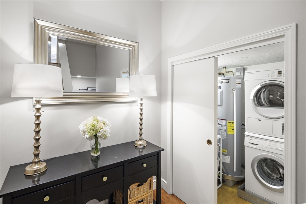 9 Appleton Street, Unit 304 Boston, MA 02116 - Photo 13 of 18 a utility room with sink dryer and washer