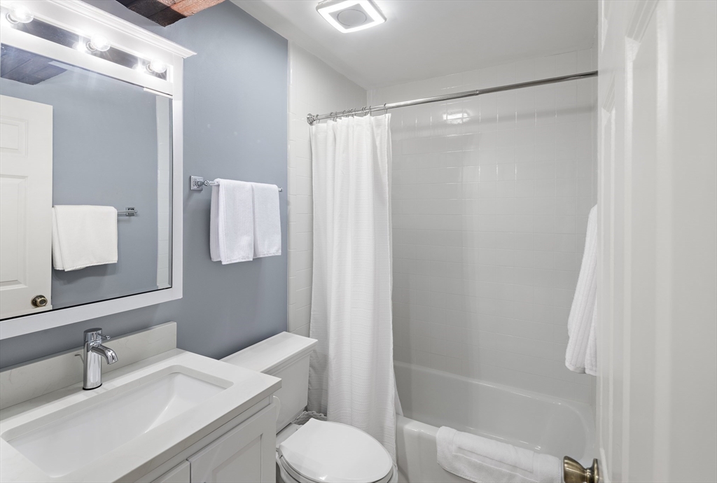 9 Appleton Street, Unit 304 Boston, MA 02116 - Photo 16 of 18 a bathroom with a sink toilet and shower