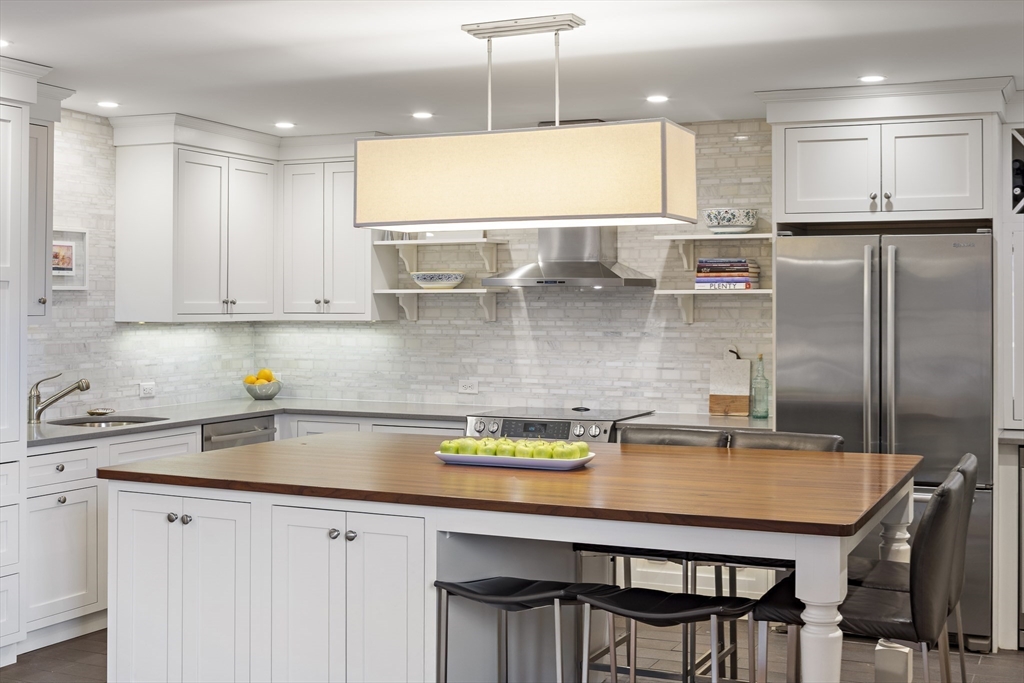 9 Appleton Street, Unit 304 Boston, MA 02116 - Photo 2 of 18 a kitchen with stainless steel appliances granite countertop a sink a stove a refrigerator and island