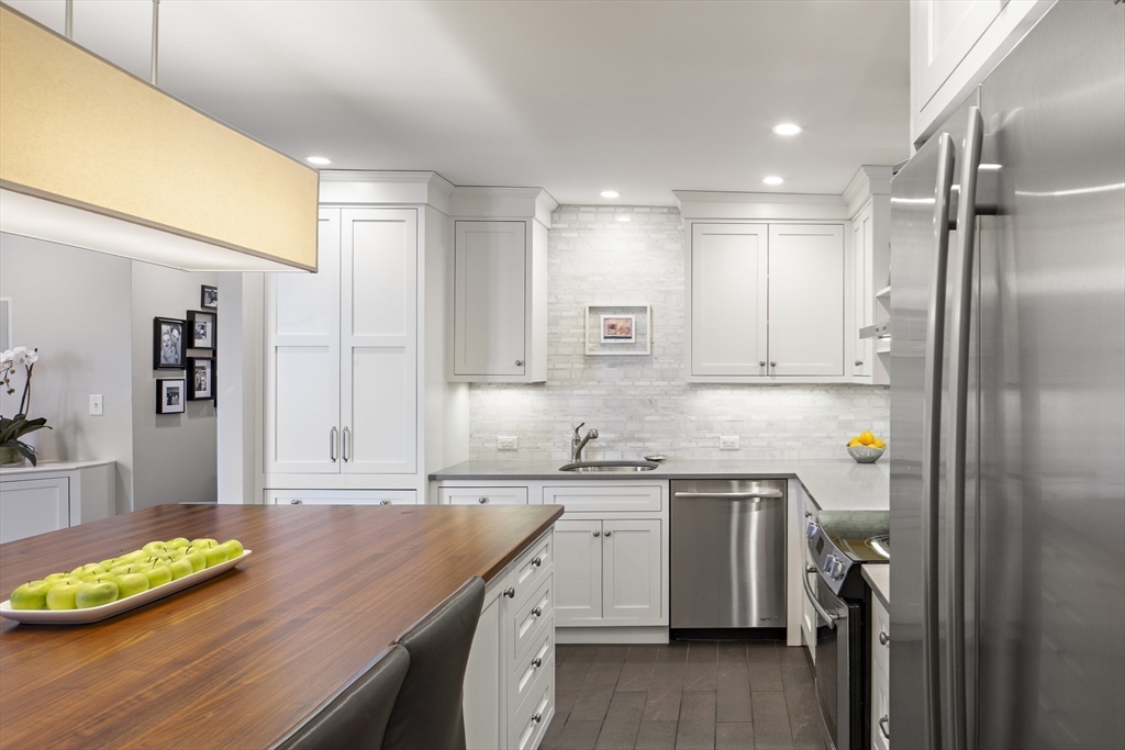 9 Appleton Street, Unit 304 Boston, MA 02116 - Photo 3 of 18 a kitchen with a sink appliances and cabinets