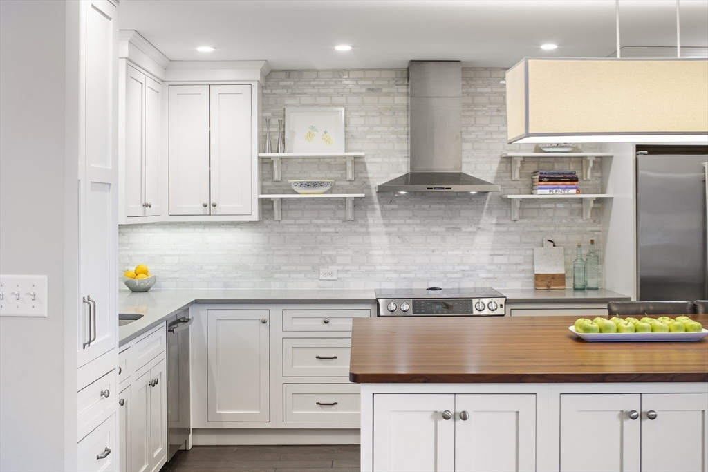 9 Appleton Street, Unit 304 Boston, MA 02116 - Photo 5 of 18 a kitchen with stainless steel appliances granite countertop a sink a stove and cabinets