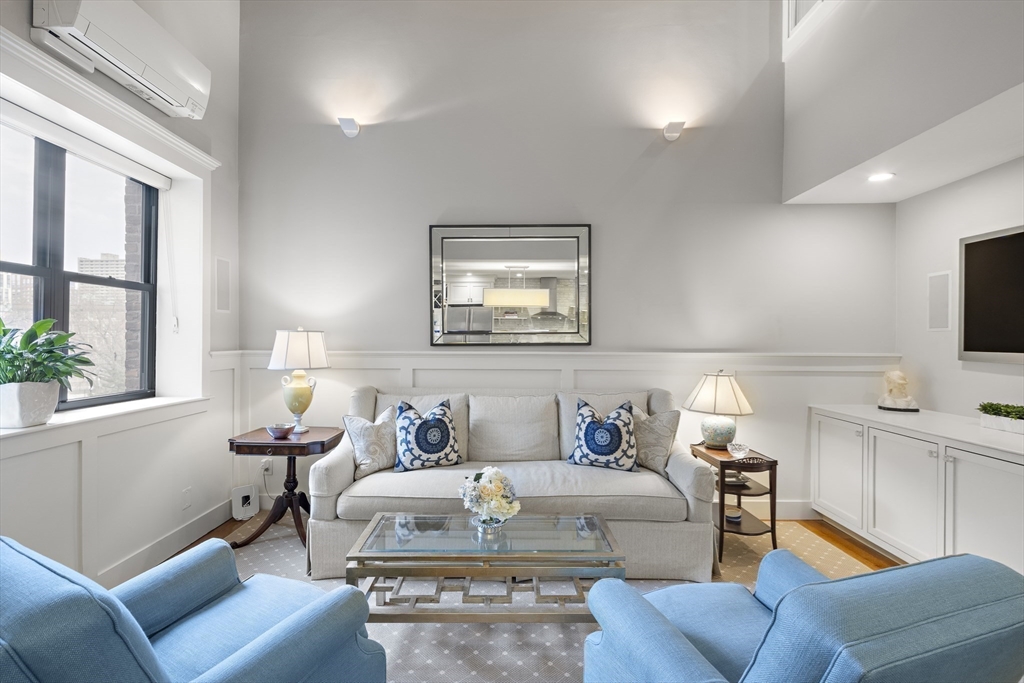 9 Appleton Street, Unit 304 Boston, MA 02116 - Photo 6 of 18 a living room with furniture and a flat screen tv