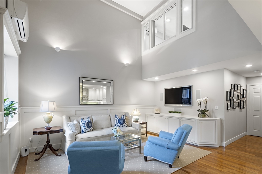 9 Appleton Street, Unit 304 Boston, MA 02116 - Photo 9 of 18 a living room with furniture and a flat screen tv