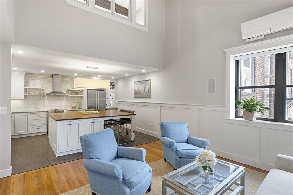 9 Appleton Street, Unit 304 Boston, MA 02116 - Photo 10 of 18 a living room with furniture and a window